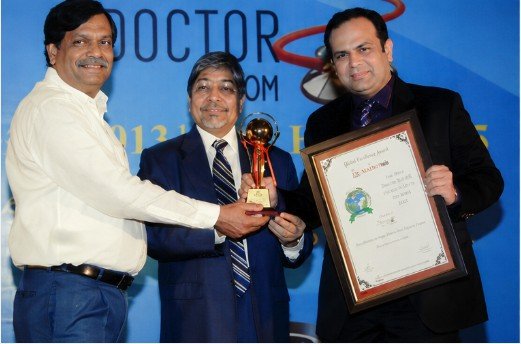 Dr. Malhotra's receiving the Global Achievers Award